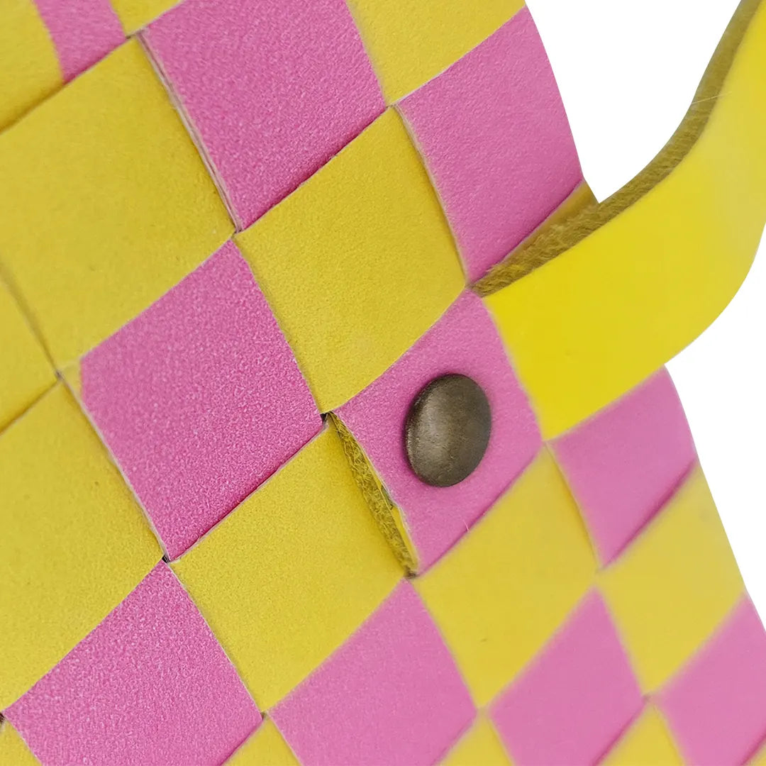 Sam Wallet 125 is a compact ReCreate wallet made from reclaimed advertising banner, with pink and yellow tones, woven detail and snap closure. - detail
