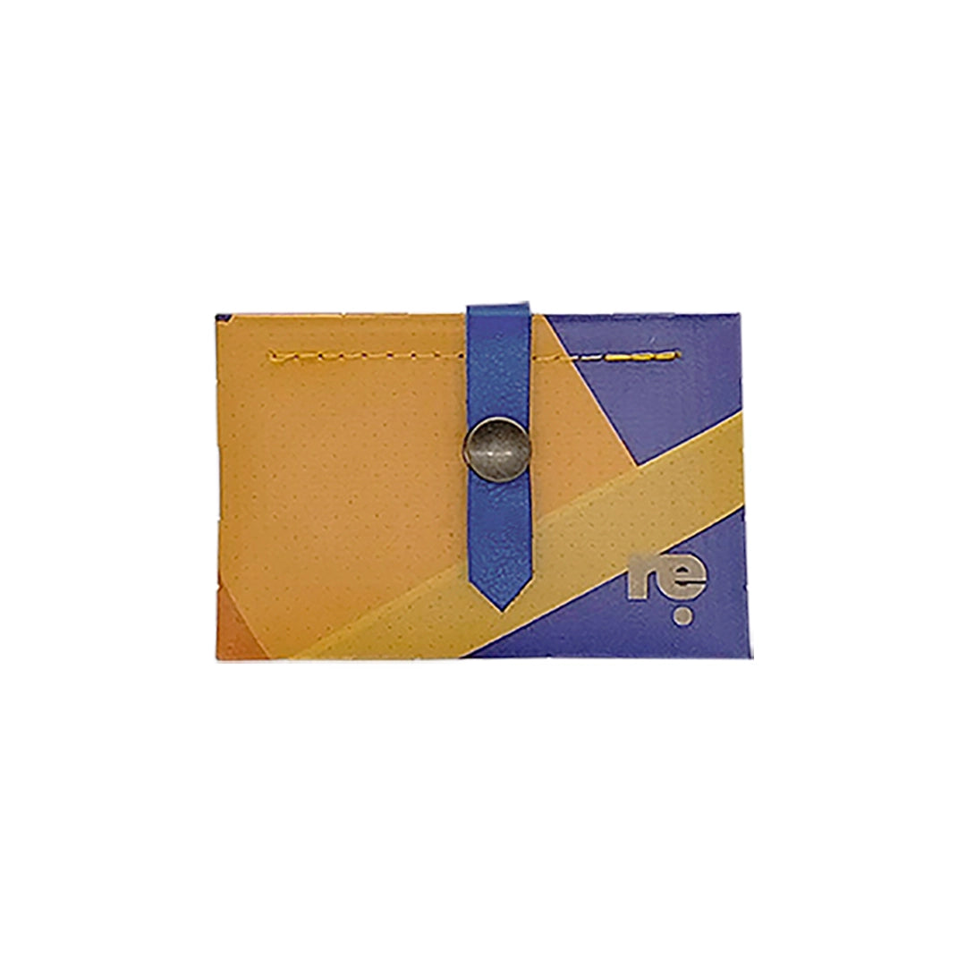 Sam Wallet 126 is a compact ReCreate wallet made from reclaimed advertising banner, with orange, violet and blue graphics and woven detail. - front