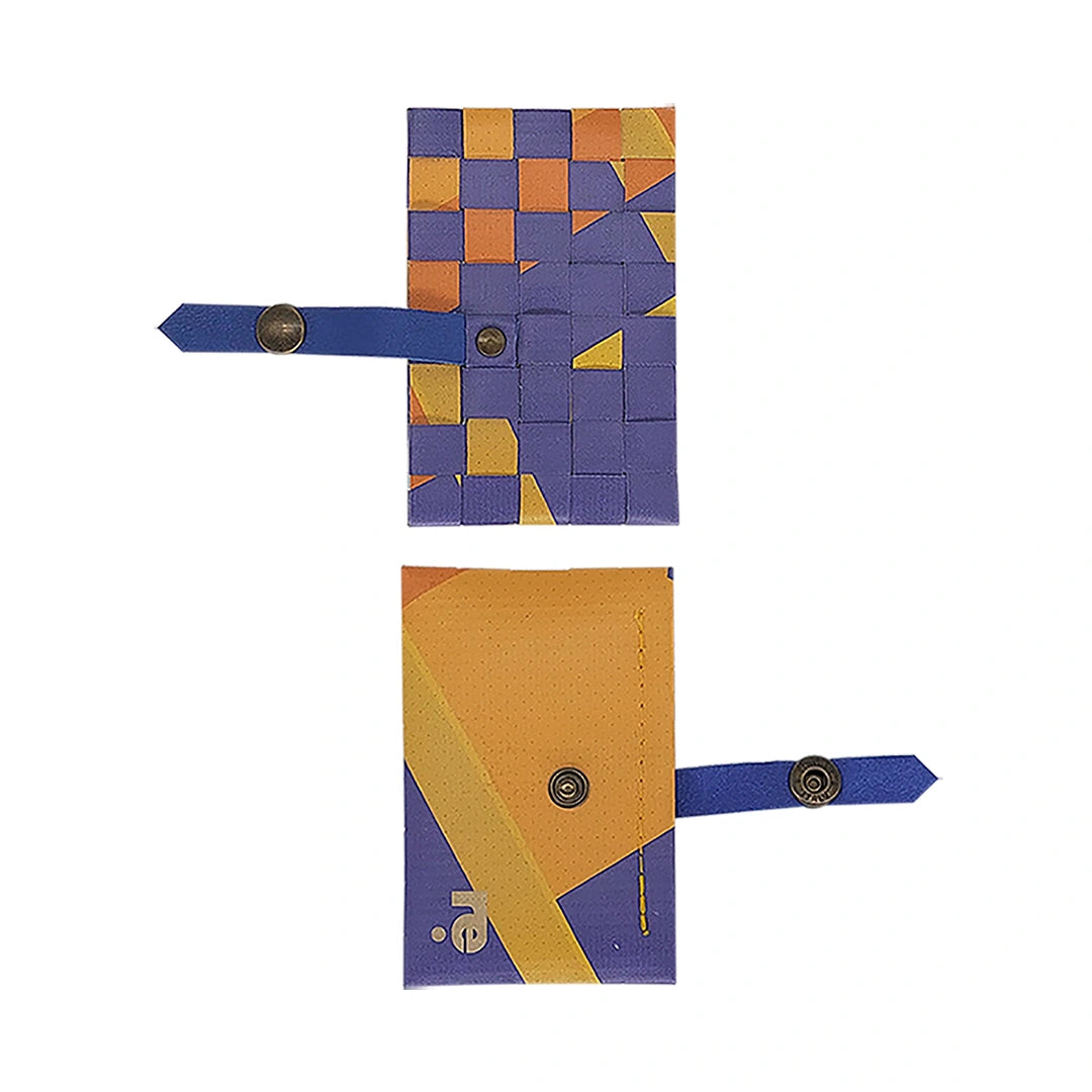Sam Wallet 126 is a compact ReCreate wallet made from reclaimed advertising banner, with orange, violet and blue graphics and woven detail. - both sides