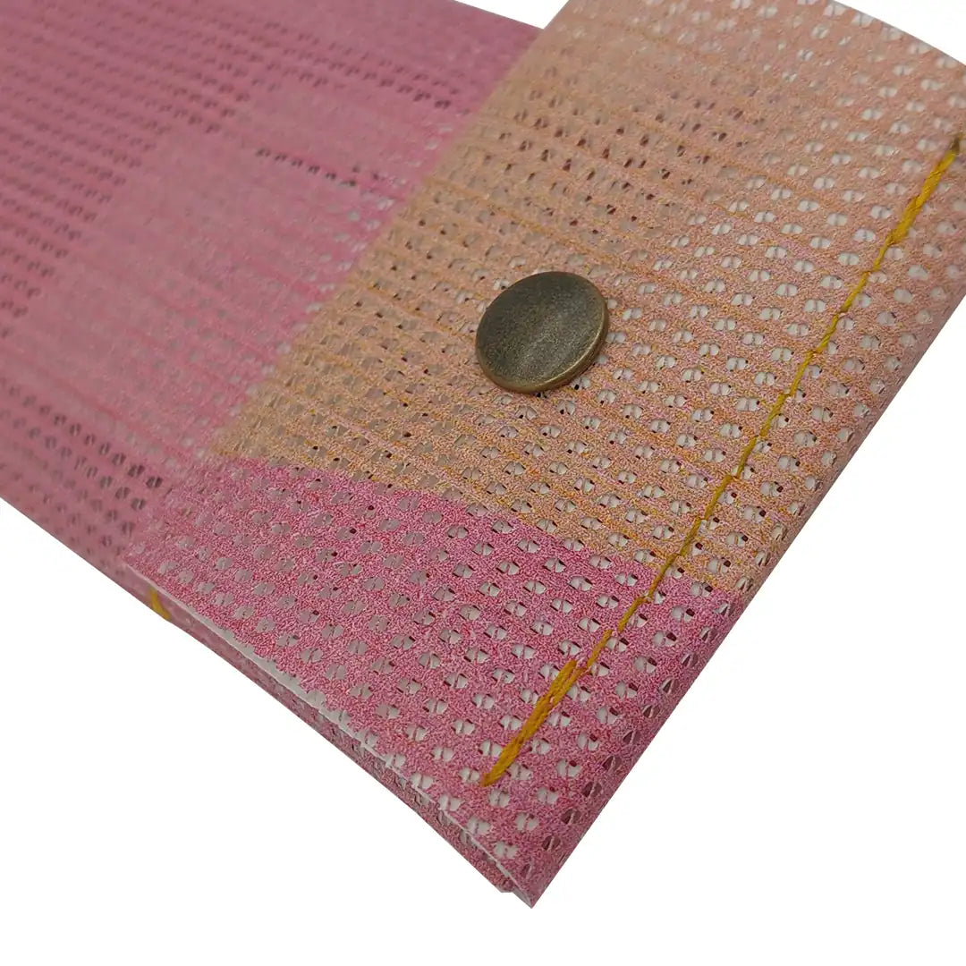 Soft pink pouch made from reclaimed micro-perforated material, designed for pencils, pens and small everyday objects. - detail