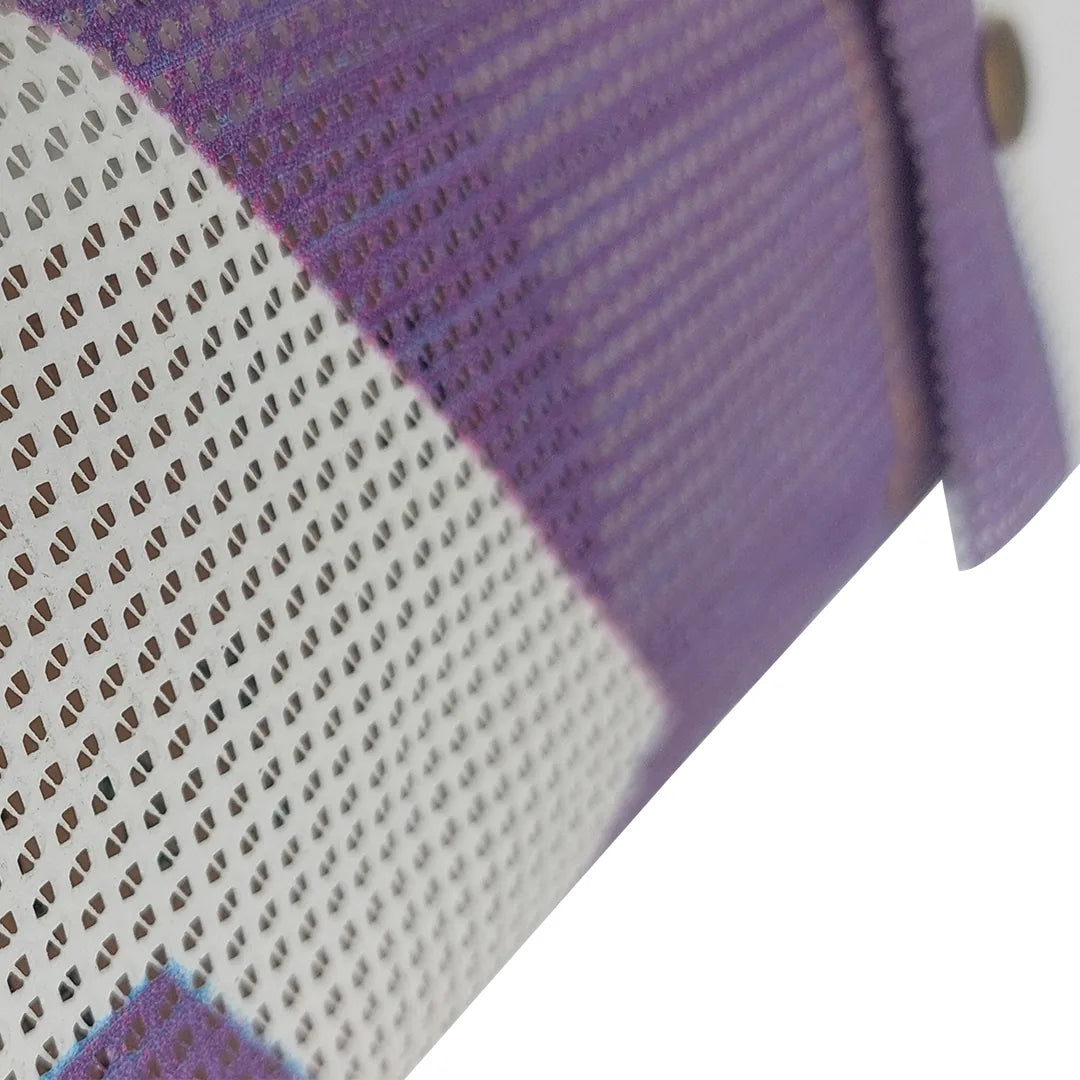 Compact pouch made from reclaimed micro-perforated banner, featuring a purple-and-white graphic surface and snap closure. - material detail