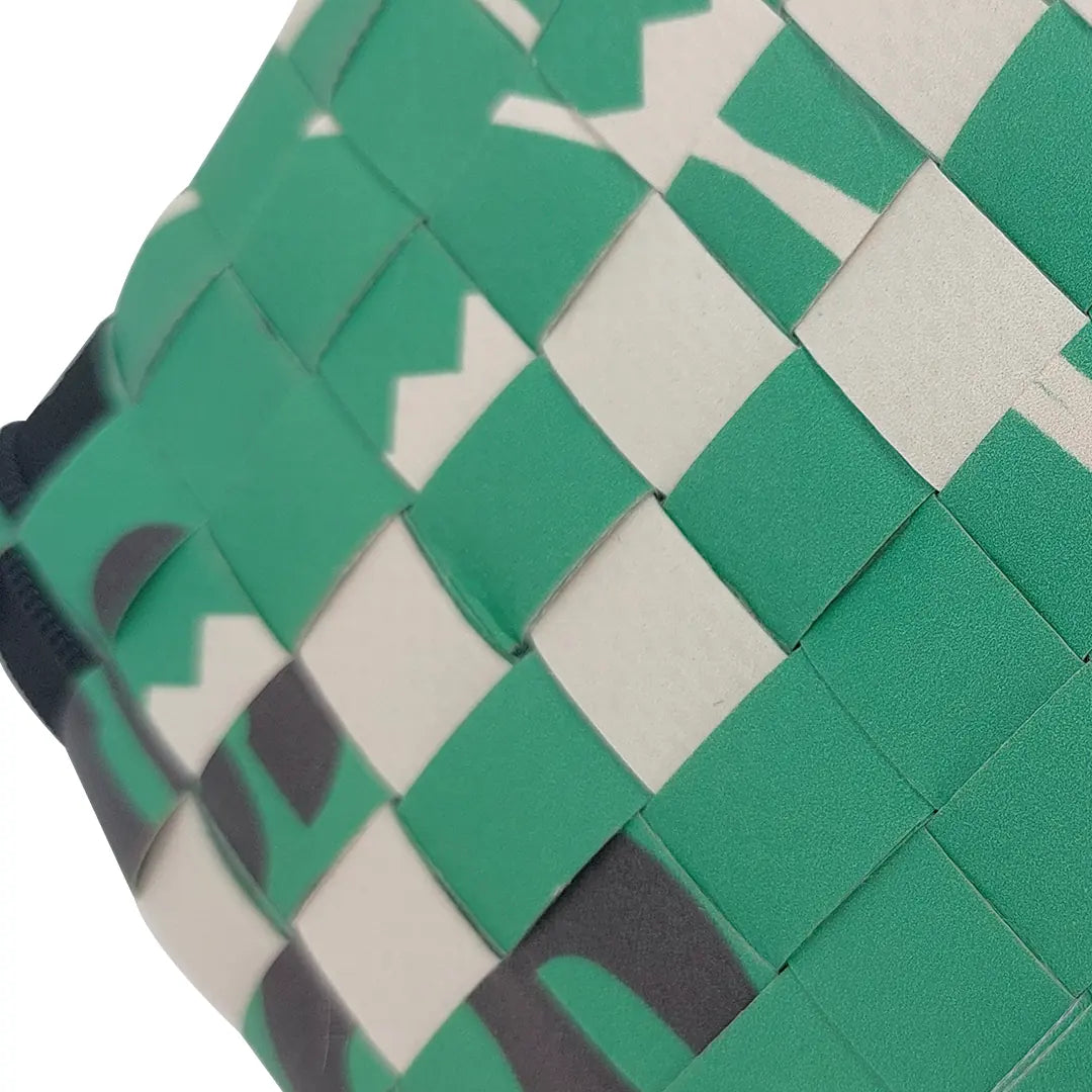 Tom Pouch 126 by ReCreate is a green small pouch in reclaimed advertising banner, with woven detail, black zip and compact everyday function. - detail