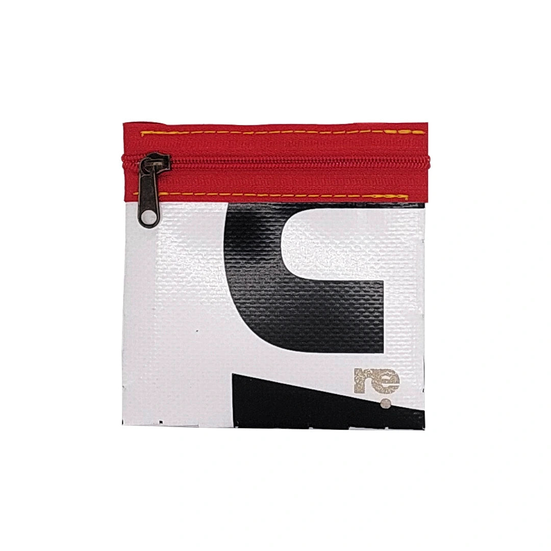 Tom Pouch 1625 is a ReCreate pouch made from reclaimed advertising banner, with black and white graphic shapes, red zip and woven back. - front