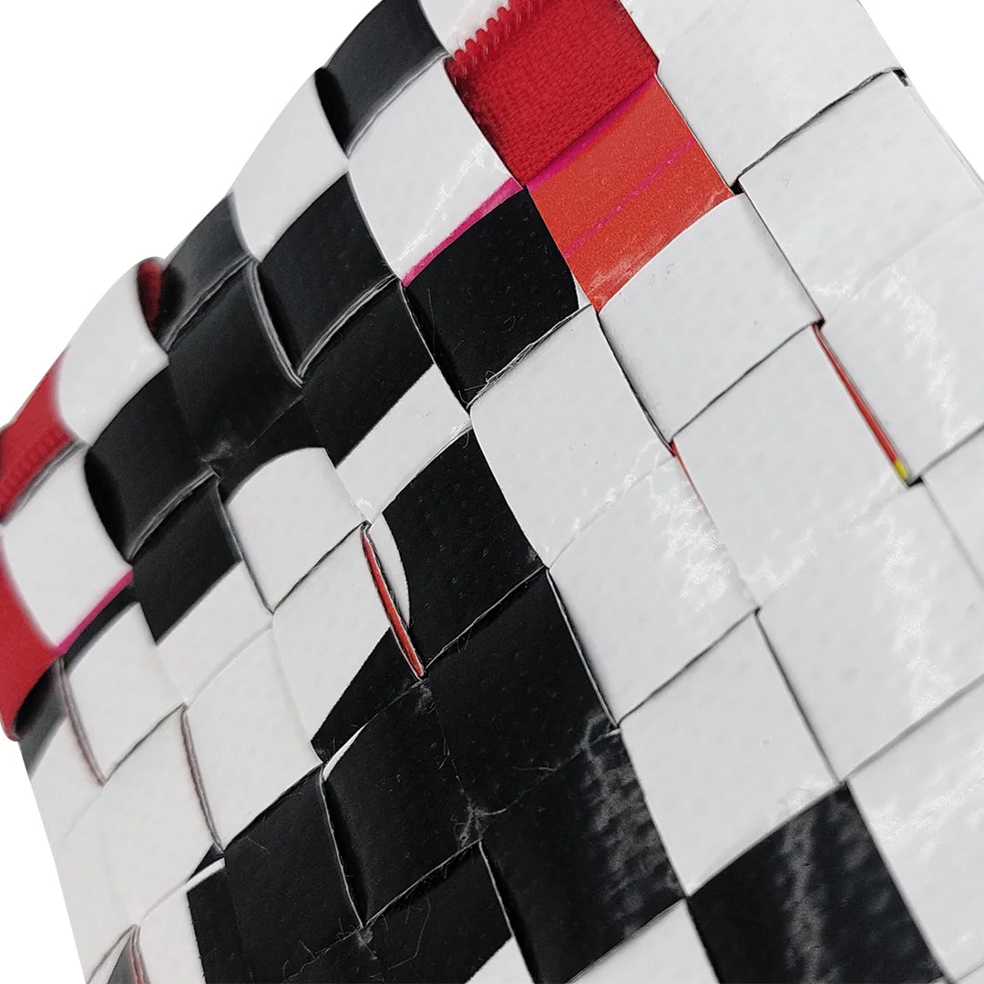 Tom Pouch 1625 is a ReCreate pouch made from reclaimed advertising banner, with black and white graphic shapes, red zip and woven back. - detail