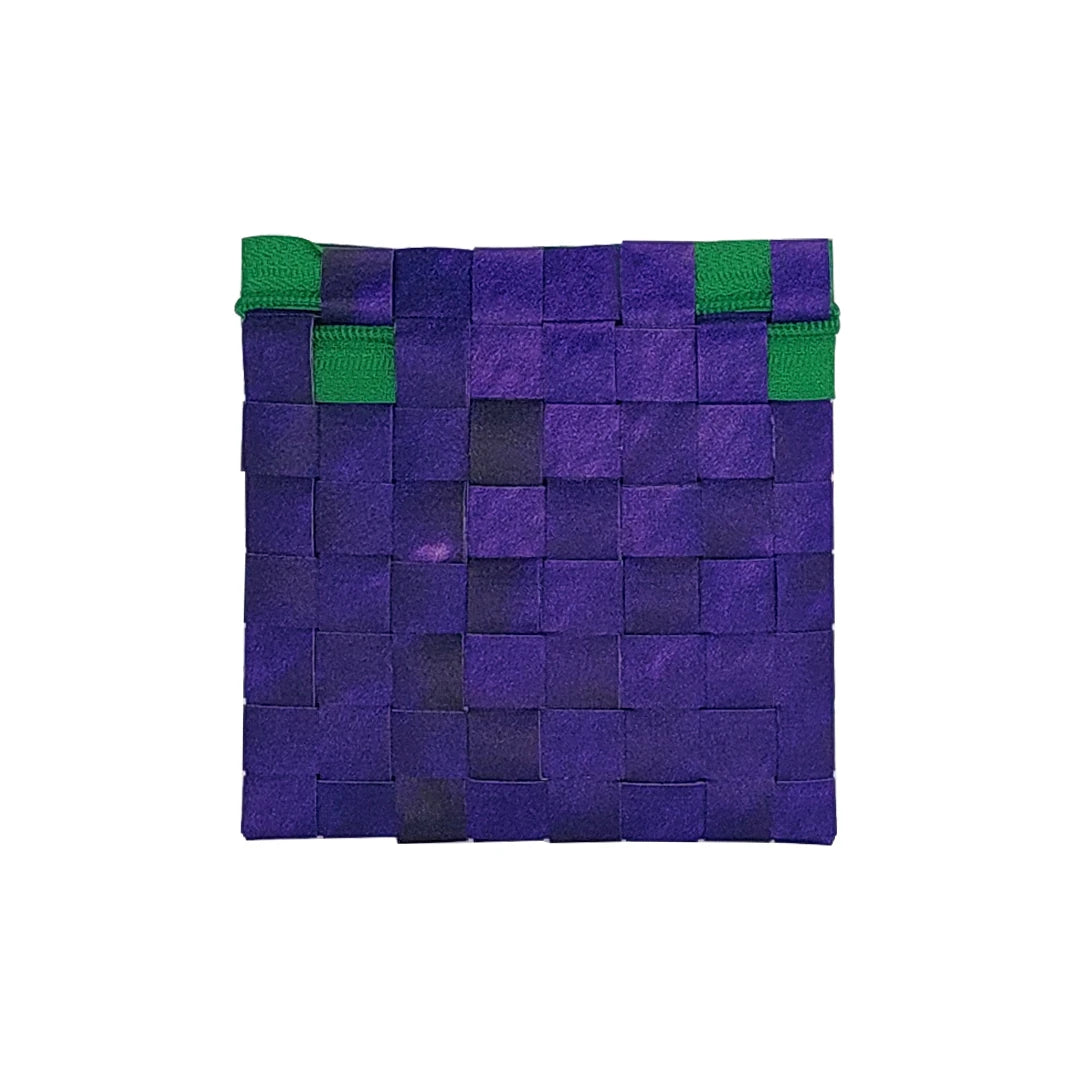 Tom Pouch 226 is a ReCreate pouch made from reclaimed advertising banner, with deep violet tones, green zip and woven back. - back