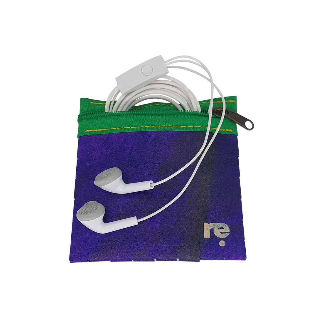 Tom Pouch 226 is a ReCreate pouch made from reclaimed advertising banner, with deep violet tones, green zip and woven back. - with phones