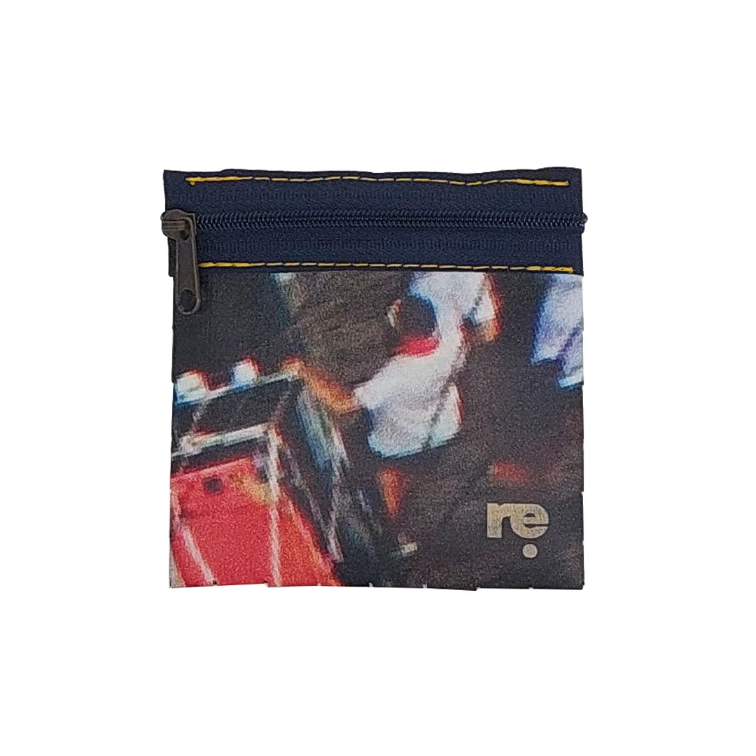 Tom Pouch 426 is a ReCreate pouch made from reclaimed advertising banner, with dark photographic tones, red flashes and woven detail. - front