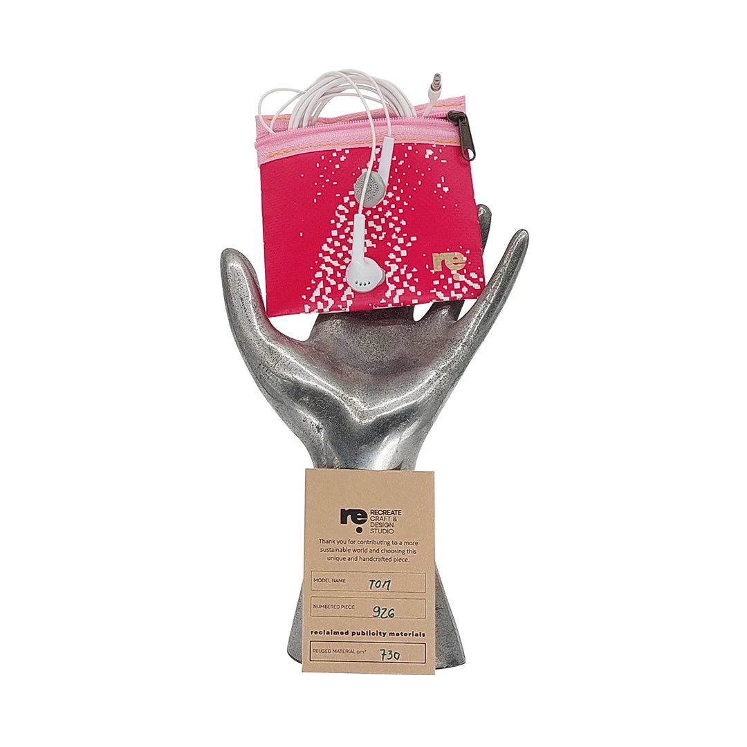 Tom Pouch 926 by ReCreate is a pink small pouch in reclaimed advertising banner, with woven texture, zip closure and room for daily essentials. - on hand